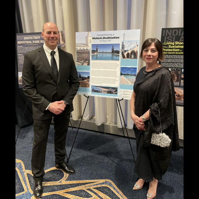 Andrew Grundy, P.E., D&B Senior Associate and Olga J, Mubarak, D&B Vice President celebrate the winning project “Playland Pool and Bathhouse Rehabilitation."