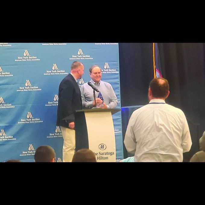 Arnold Palleschi accepts the prestigious John M. Diven Jr. Award on stage.