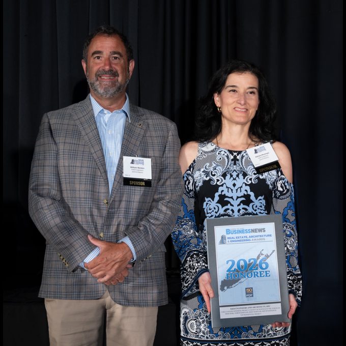 Bill Merklin, P.E., D&B President & CEO with Adriana Restrepo, P.E., ENV SP, D&B Vice President accepting the LIBN Residential Award